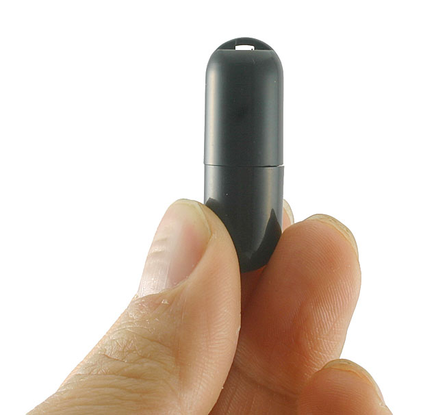 iPhone and Peterson Tuners Mini Capsule Microphone for iStroboSoft in hand.